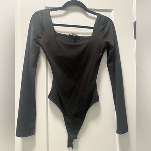 Black body suit with open back